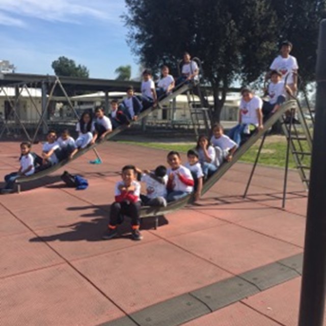 Our scholars celebrate their literary achievements with their new t-shirts, awarded by our staff.